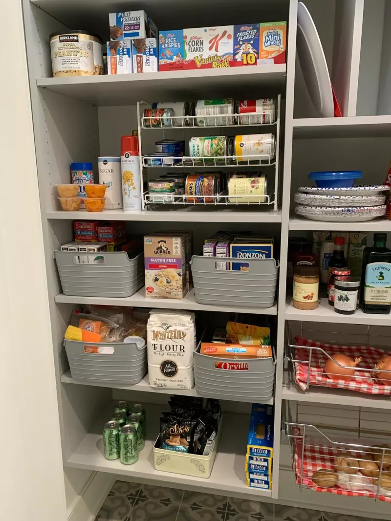 Organized pantry with labeled bins and clear shelves